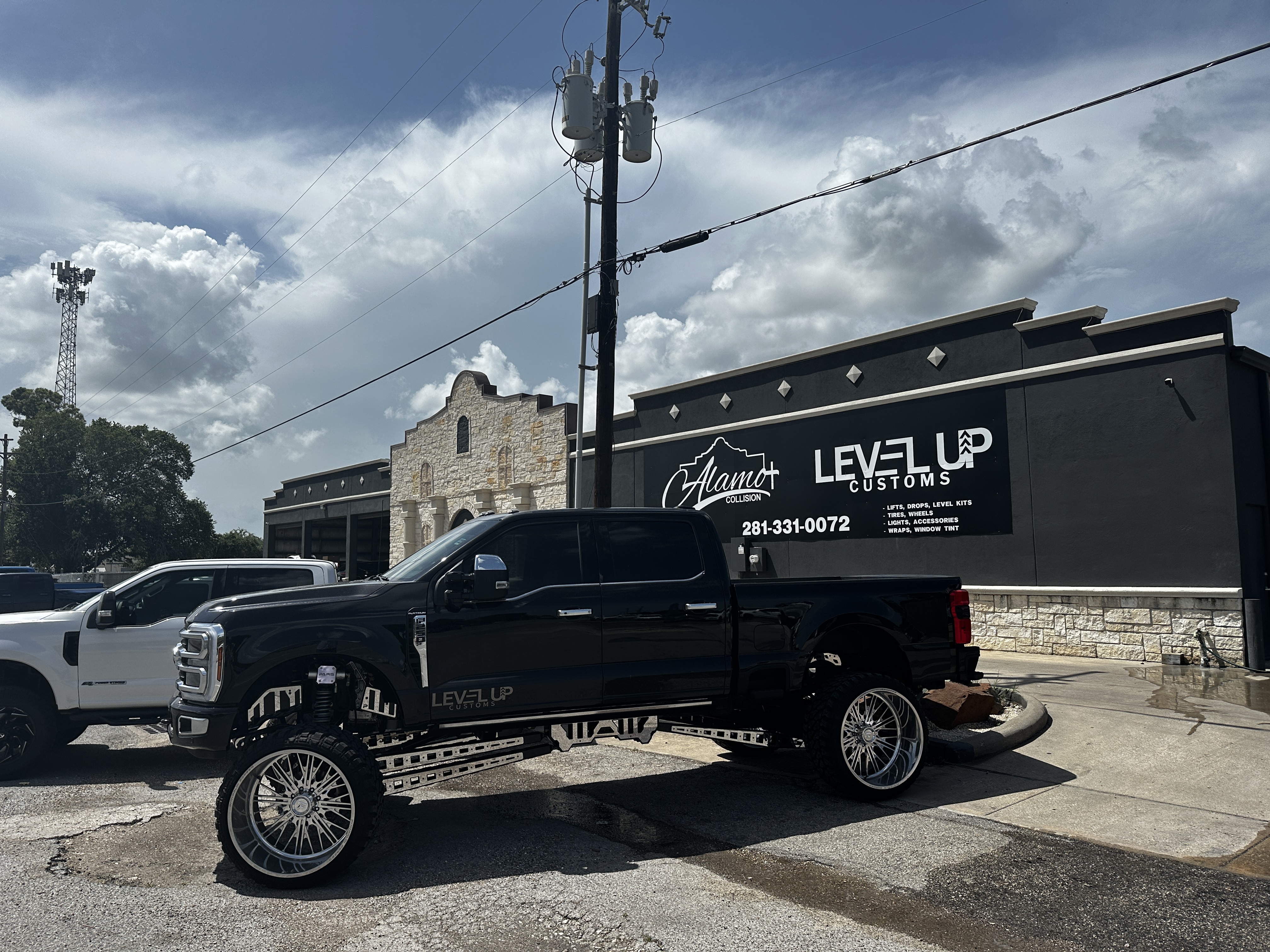 Black Ford F-250 build at Level Up Customs shop, Alvin TX