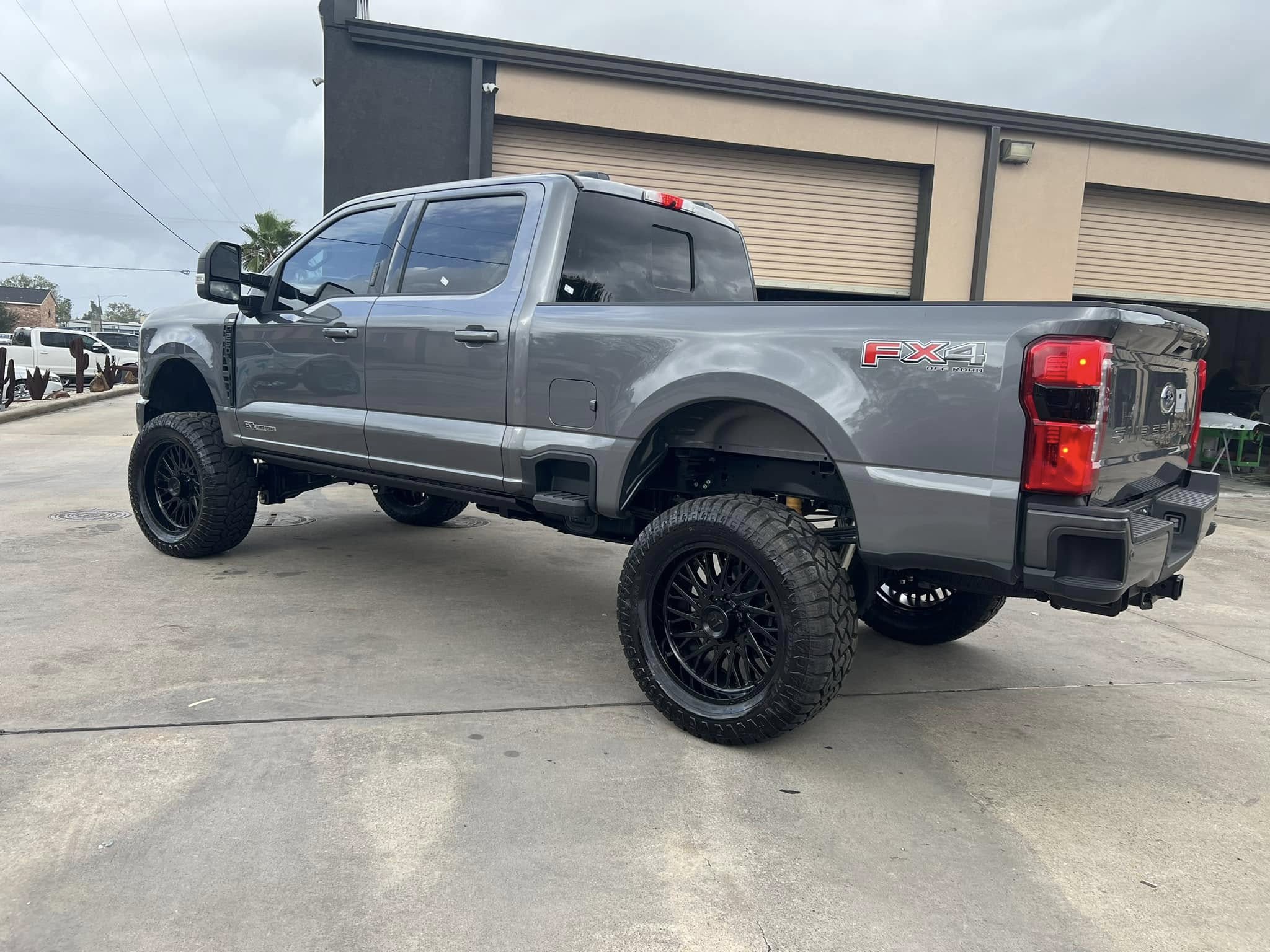 Grey Ford Super Duty with custom forged-style wheels, Level Up Customs, Alvin TX