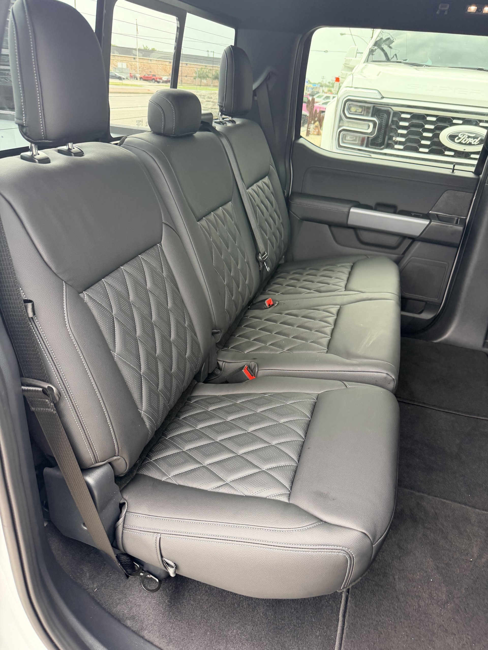 Ford F-150 with black diamond-stitch leather rear bench seat, Level Up Customs, Alvin TX