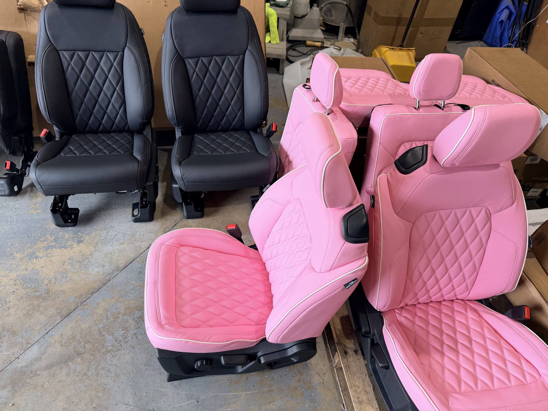 Custom pink and black leather seats being built in Level Up Customs shop, Alvin TX